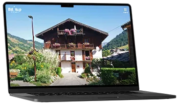 un pc affiche la page d'accueil du Chalet Bel Alp